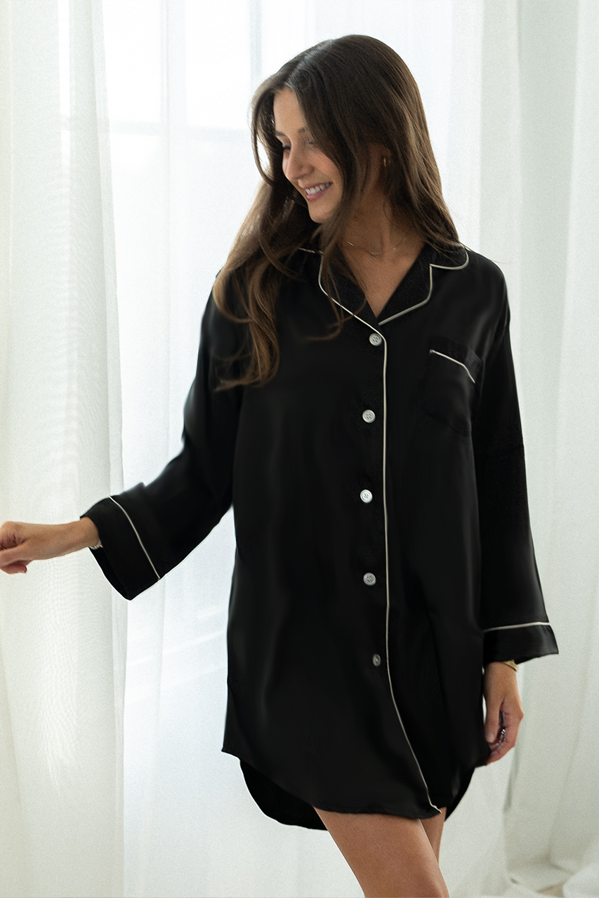 Elegant Black Satin Sleep Shirt offers oversized comfort for a luxurious night's rest. Perfect for bedtime relaxation.